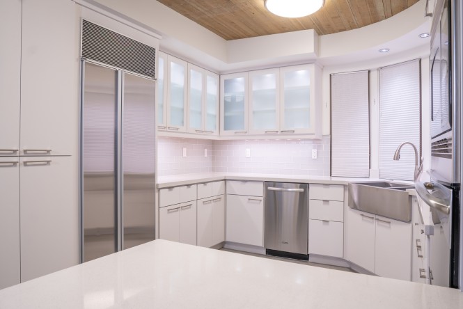 Paradise Valley Residence — Caesarstone quartz kitchen and primary bath with new porcelain flooring throughout, executed to a deliberate finish standard.