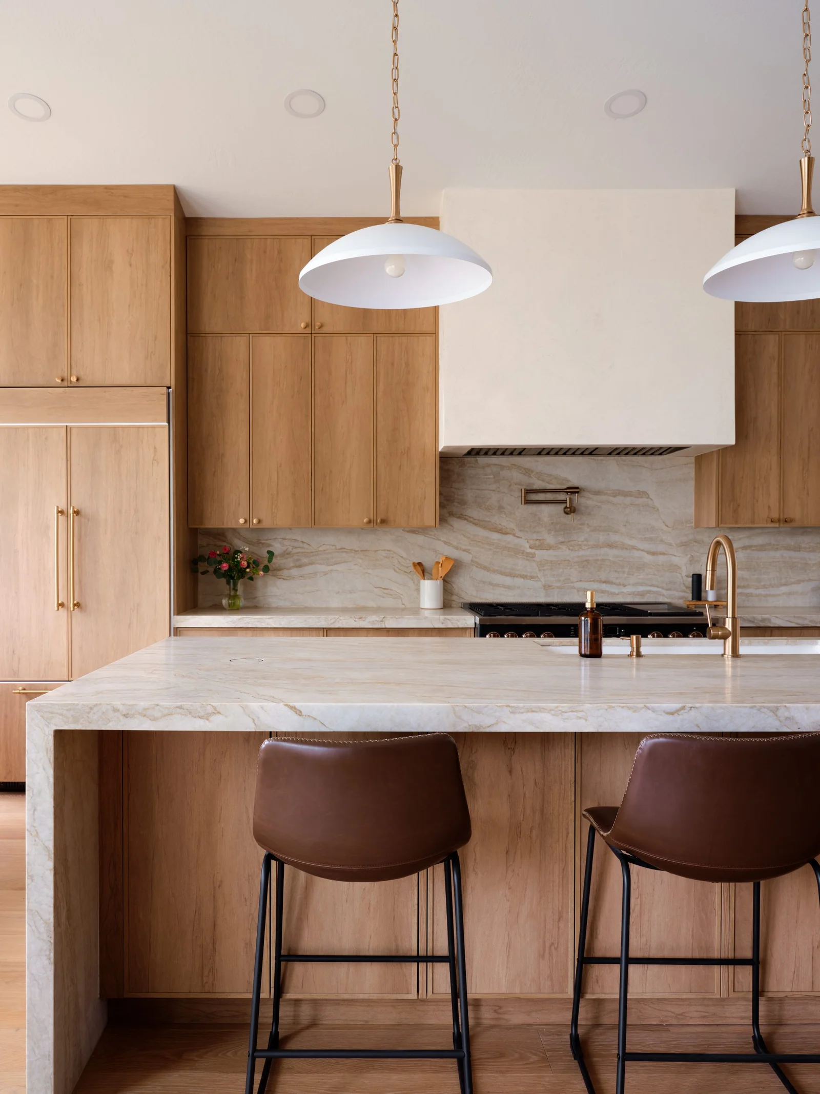 Waterfall island & brass fixtures